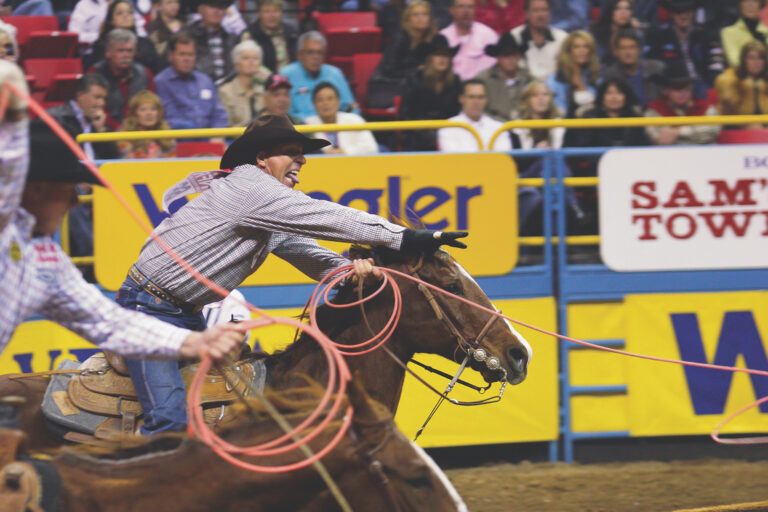 Jake Barnes and Clay O'Brien Cooper roping at the National Finals Rodeo