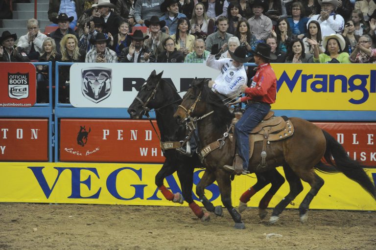 Chad Masters and Champ celebrating another winning run at the 2012 NFR.