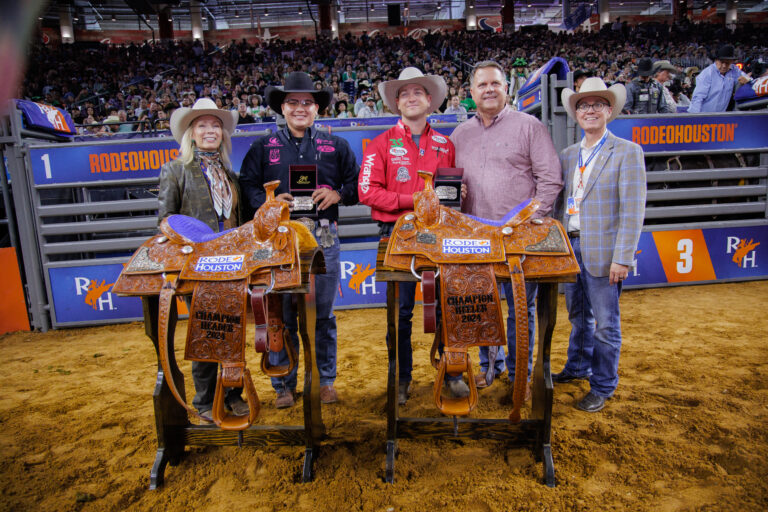 JC Yeahquo and Buddy Hawkins posing with their championship saddles after winning RodeoHouston 2024.
