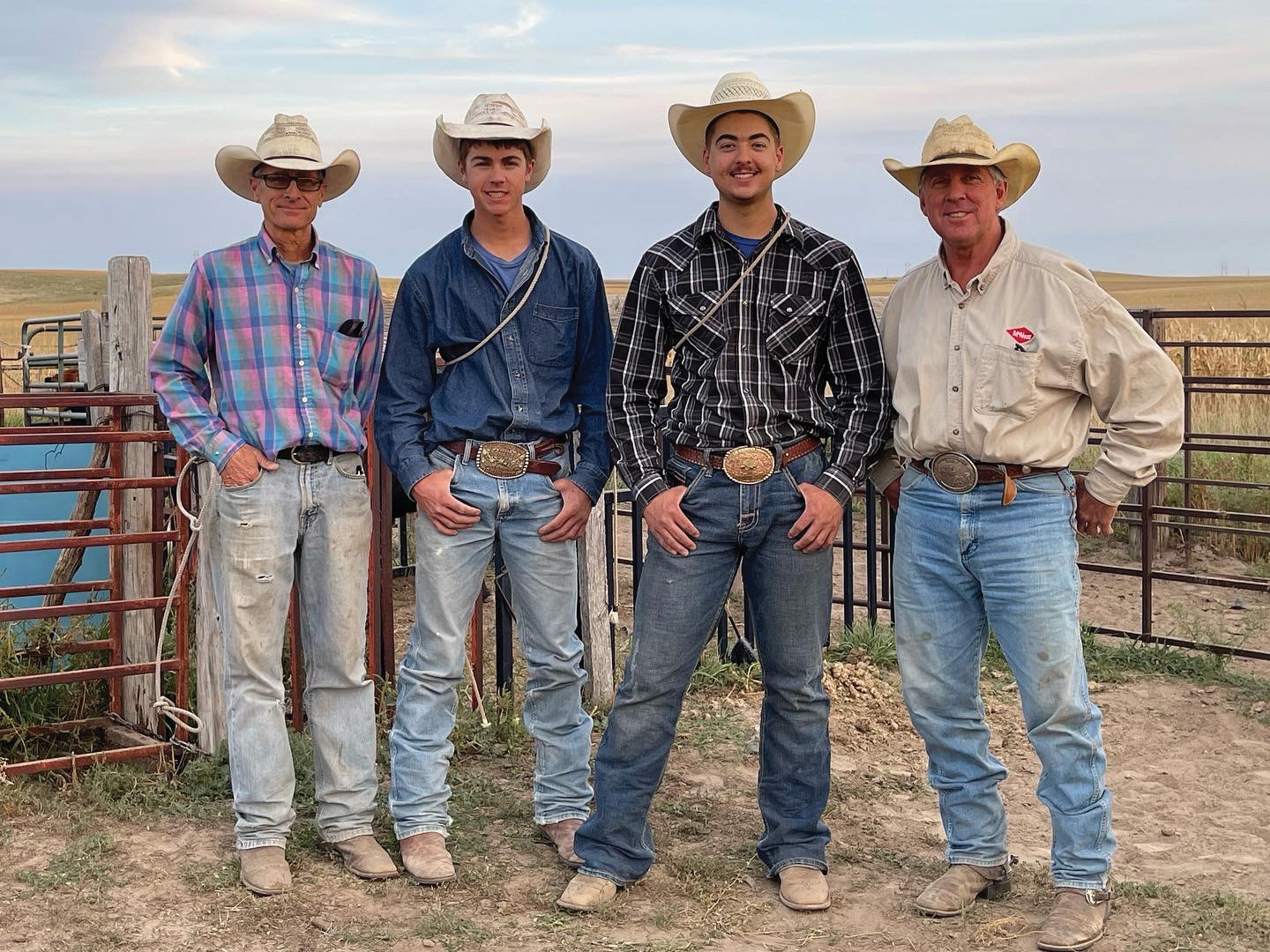 Ralph Saults is pictured with his dad, Scott, and his brother Jate on the left and, on the right, his uncle, steer roper Will McBride.